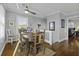 Comfortable dining room with natural light, six chairs, wood table, and a cozy atmosphere at 1504 Forrest Ave, Folly Beach, SC 29439