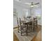 Charming dining room featuring a wooden table set for six, windows, and decor at 1504 Forrest Ave, Folly Beach, SC 29439