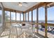 Inviting screened dining area provides stunning views of the waterway and surrounding nature at 1504 Forrest Ave, Folly Beach, SC 29439