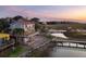 Stunning coastal home featuring a spacious deck overlooking a serene waterfront and private dock at 1504 Forrest Ave, Folly Beach, SC 29439