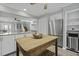 Spacious kitchen featuring stainless steel appliances, white cabinetry, and wood island at 1504 Forrest Ave, Folly Beach, SC 29439