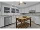 Bright kitchen with stainless steel appliances, ample counter space, and wood floors at 1504 Forrest Ave, Folly Beach, SC 29439