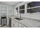 Kitchen with stainless steel appliances, granite countertops, and ample natural light at 1504 Forrest Ave, Folly Beach, SC 29439