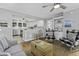 Open-concept living space with views into the kitchen, stylish furnishings, and an airy atmosphere at 1504 Forrest Ave, Folly Beach, SC 29439