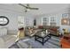 Comfortable living room with ceiling fan, and cozy seating at 1504 Forrest Ave, Folly Beach, SC 29439