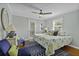 Cozy main bedroom featuring hardwood floors, lots of natural light, and tasteful decor at 1504 Forrest Ave, Folly Beach, SC 29439
