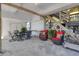 Comfortable outdoor seating area with tables and wicker chairs and lush greenery at 1504 Forrest Ave, Folly Beach, SC 29439