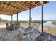 Comfortable outdoor space with Adirondack chairs and a table setting, ideal for unwinding at 1504 Forrest Ave, Folly Beach, SC 29439