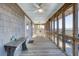 Inviting screened porch featuring wood floors, a ceiling fan, and lovely views at 1504 Forrest Ave, Folly Beach, SC 29439