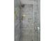 Elegant bathroom featuring a walk-in shower with decorative tiling and a rain shower head at 1504 Forrest Ave, Folly Beach, SC 29439