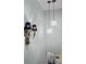 Stairwell with unique lighting fixtures at 1504 Forrest Ave, Folly Beach, SC 29439