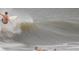Surfer gliding on wave, depicting fun lifestyle near the beach at 1504 Forrest Ave, Folly Beach, SC 29439