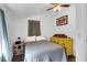 Cozy bedroom featuring a bright yellow dresser, ceiling fan, and decorative accents at 1617 Balsam St, Charleston, SC 29407