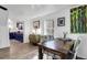Open dining area with hardwood floors, modern furnishings, and kitchen access at 1617 Balsam St, Charleston, SC 29407