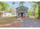 Charming two-story home with a fenced yard, inviting curb appeal and shade trees at 1617 Balsam St, Charleston, SC 29407