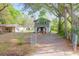 Charming two-story home with a fenced yard, inviting curb appeal and shade trees at 1617 Balsam St, Charleston, SC 29407