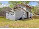 Exterior view of the house and backyard, showcasing the architecture and outdoor space at 1617 Balsam St, Charleston, SC 29407