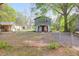 Charming two-story home with a fenced yard, inviting curb appeal and shade trees at 1617 Balsam St, Charleston, SC 29407