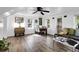 Open-concept living and dining area with hardwood floors, and plenty of natural light at 1617 Balsam St, Charleston, SC 29407