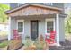 Inviting front porch with rocking chairs and string lights, creating a cozy outdoor space at 1617 Balsam St, Charleston, SC 29407