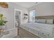 Comfortable bedroom featuring a large bed, ample natural light, and ensuite bathroom at 1675 Indy Dr, North Charleston, SC 29405