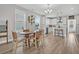 Inviting dining area open to kitchen, perfect for gatherings, with lots of natural light at 1675 Indy Dr, North Charleston, SC 29405
