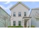 Charming two-story home with white siding, inviting entrance and well-maintained landscaping at 1675 Indy Dr, North Charleston, SC 29405