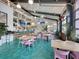 Bright interior featuring a bar, tables, chairs, vibrant artwork, and a cheerful atmosphere at 1675 Indy Dr, North Charleston, SC 29405