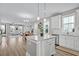 Bright, airy kitchen showcasing a central island, stainless appliances, and seamless flow to the dining area at 1675 Indy Dr, North Charleston, SC 29405