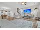 Open-concept living room with television, dining area, and staircase at 1675 Indy Dr, North Charleston, SC 29405