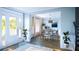 Bright dining room featuring hardwood floors and view into an open floor plan at 1679 Cultivation Ln # 459, Mount Pleasant, SC 29466