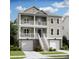 Charming two-story home featuring double balconies, a two car garage and elevated entry stairs at 1679 Cultivation Ln # 459, Mount Pleasant, SC 29466
