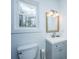 Cozy bathroom featuring a gray vanity, white toilet, and window providing natural light at 184 Ponderosa Dr, Ladson, SC 29456