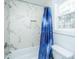 Bright bathroom boasting a shower with stylish marble tile and a whimsical star-themed shower curtain at 184 Ponderosa Dr, Ladson, SC 29456