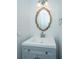 A bathroom featuring a stylish, wavy-framed mirror and modern vanity sink at 184 Ponderosa Dr, Ladson, SC 29456
