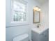 Bathroom with gray vanity, updated fixtures, a white toilet, and bright natural light at 184 Ponderosa Dr, Ladson, SC 29456