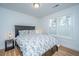 Inviting bedroom showcasing a queen bed, bedside tables with lamps, and a bright window at 184 Ponderosa Dr, Ladson, SC 29456