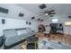Spacious bonus room features a comfortable sitting area, media center, and natural light at 184 Ponderosa Dr, Ladson, SC 29456
