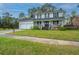 Charming two-story home featuring a welcoming front porch and well-maintained lawn with a two car garage at 184 Ponderosa Dr, Ladson, SC 29456