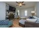 Inviting living room featuring a stone fireplace, hardwood floors, and lots of windows for ample natural light at 184 Ponderosa Dr, Ladson, SC 29456