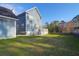 The home features a spacious backyard with a well-manicured lawn at 2107 Military Way, Charleston, SC 29414