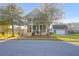 Charming two-story home with a welcoming front porch and landscaped yard at 2107 Military Way, Charleston, SC 29414