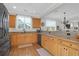 Kitchen featuring light wood cabinets, hardwood floors, and modern appliances at 2107 Military Way, Charleston, SC 29414