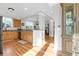 Kitchen with hardwood floors, light wood cabinets, and granite countertops at 2107 Military Way, Charleston, SC 29414