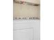 Laundry room features full size washer and dryer with storage shelf above at 2107 Military Way, Charleston, SC 29414