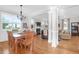 Bright open-concept living and dining room boasts hardwood floors, fireplace, and abundant natural light at 2107 Military Way, Charleston, SC 29414