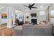 Bright open living area features hardwood floors, fireplace, comfortable seating and a kitchen view at 2107 Military Way, Charleston, SC 29414