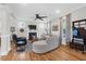 Bright open living area features hardwood floors, fireplace, and comfortable seating at 2107 Military Way, Charleston, SC 29414