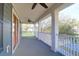 Expansive outdoor area with neutral flooring, white railing and ceiling fan great for relaxing at 2107 Military Way, Charleston, SC 29414