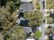 A bird's eye view shows a backyard with a patio area and mature trees surrounding this beautifully landscaped house at 2187 Annie Laura Ln, Mount Pleasant, SC 29466